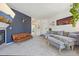 Spacious living room with a stylish sectional sofa, fireplace, and adjacent dining area at 6850 Xavier Cir # 5, Westminster, CO 80030