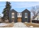 Striking modern home featuring a black and white facade and large windows at 2961 S Cherokee St, Englewood, CO 80110