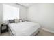 Spacious bedroom with a king-size bed and bedside table at 1208 Quitman St # 303, Denver, CO 80204