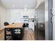 Modern kitchen with stainless steel appliances and wood butcher block island at 1208 Quitman St # 303, Denver, CO 80204