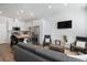 Modern kitchen features stainless steel appliances and a butcher block island at 1208 Quitman St # 303, Denver, CO 80204