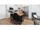 Modern kitchen with stainless steel appliances and butcher block island at 1208 Quitman St # 303, Denver, CO 80204