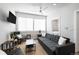 Comfortable living room with sofa, armchairs, and flat-screen TV at 1208 Quitman St # 303, Denver, CO 80204