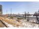 Light rail station with trains and winter landscaping at 1208 Quitman St # 303, Denver, CO 80204