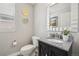 Chic powder room featuring a patterned floor, granite countertop, and stylish mirror for a modern touch at 12110 Bay Oaks Ct, Parker, CO 80138