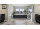 Luxurious bathroom with a soaking tub, separate shower, and large windows providing a spa-like experience at 12110 Bay Oaks Ct, Parker, CO 80138