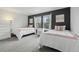 Bedroom with two twin beds and a large window at 12110 Bay Oaks Ct, Parker, CO 80138