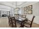 Elegant dining room with wood table, decorative lighting, and wainscoting providing an inviting space for meals at 12110 Bay Oaks Ct, Parker, CO 80138