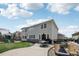 View of the home exterior showing a large backyard with a patio and fire pit at 12110 Bay Oaks Ct, Parker, CO 80138