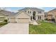 Charming two-story home with a well-manicured lawn and a three-car garage at 12110 Bay Oaks Ct, Parker, CO 80138