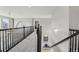 Bright upstairs hallway with stylish railings leading to bedrooms, creating an airy and inviting transition at 12110 Bay Oaks Ct, Parker, CO 80138