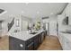 Updated kitchen with a large island, stainless appliances and a breakfast nook at 12110 Bay Oaks Ct, Parker, CO 80138