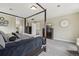 Spacious bedroom featuring a four-poster bed, dresser, and carpeting offering a comfortable living space at 12110 Bay Oaks Ct, Parker, CO 80138