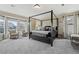 Serene main bedroom with a canopy bed, soft carpeting, and ample natural light creating a relaxing retreat at 12110 Bay Oaks Ct, Parker, CO 80138