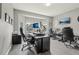 Spacious office with multiple workstations, natural light, and modern decor for a productive work environment at 12110 Bay Oaks Ct, Parker, CO 80138
