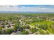 Wide aerial view showcasing neighborhood amenities and mountain views in the distance at 10016 Teton Ct, Lone Tree, CO 80124