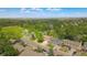 Aerial view of the neighborhood with mature trees, a greenbelt, and a park at 10016 Teton Ct, Lone Tree, CO 80124