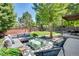 Spacious backyard with ample seating on the patio with a sectional sofa, ottoman and accent chairs for outdoor living at 10016 Teton Ct, Lone Tree, CO 80124