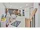 Finished basement features a play area, neutral carpet, white walls, and wood accent wall for entertainment at 10016 Teton Ct, Lone Tree, CO 80124