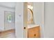 Stylish powder room with modern vanity, gold fixtures, and attractive lighting at 10016 Teton Ct, Lone Tree, CO 80124
