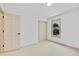 Bright bedroom with a window, closet, and neutral-toned carpet providing a cozy and inviting atmosphere at 10016 Teton Ct, Lone Tree, CO 80124