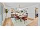 Bright dining room featuring a stylish chandelier, modern art, and a dining table with seating for six at 10016 Teton Ct, Lone Tree, CO 80124