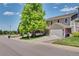 Charming two-story home with mature tree and well-manicured lawn at 10016 Teton Ct, Lone Tree, CO 80124