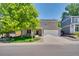 Charming two-story home with mature tree and well-manicured lawn at 10016 Teton Ct, Lone Tree, CO 80124