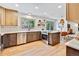 Well-lit kitchen featuring modern appliances, sleek countertops, and a charming breakfast nook with natural light at 10016 Teton Ct, Lone Tree, CO 80124