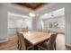 Open dining room featuring a coffered ceiling, modern lighting, and views of the surrounding area at 4364 Chateau Ridge Ln, Castle Rock, CO 80108