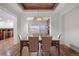 Spacious dining room featuring hardwood floors, designer lighting, and an open concept layout at 4364 Chateau Ridge Ln, Castle Rock, CO 80108