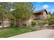 Beautiful exterior of a two-story home with stone accents, balcony, and landscaped front yard at 4364 Chateau Ridge Ln, Castle Rock, CO 80108