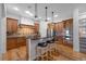 Bright kitchen features stainless steel appliances, a breakfast bar with seating, and lots of cabinet space at 4364 Chateau Ridge Ln, Castle Rock, CO 80108