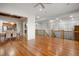 Open living area featuring wood floors, a dining area and stairs to the upper level at 4364 Chateau Ridge Ln, Castle Rock, CO 80108
