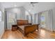 Spacious bedroom boasts vaulted ceilings, wood floors, and access to the outdoors at 4364 Chateau Ridge Ln, Castle Rock, CO 80108
