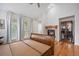 This spacious bedroom has a fireplace, wood floors, and access to a balcony at 4364 Chateau Ridge Ln, Castle Rock, CO 80108