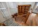 Stairway featuring a built-in bookcase, wood floors and stairway runner at 4364 Chateau Ridge Ln, Castle Rock, CO 80108