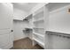 This walk-in closet features built-in shelving for optimal storage at 4364 Chateau Ridge Ln, Castle Rock, CO 80108