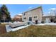 Inviting backyard featuring a patio with outdoor seating, a grill, and a manicured lawn at 1004 Roslyn Ct, Denver, CO 80230