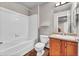 Bathroom features a shower and tub combination, a vanity and tiled flooring at 17359 Waterhouse Cir # C, Parker, CO 80134