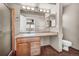 Bathroom featuring tiled floors, wood vanity and shower at 17359 Waterhouse Cir # C, Parker, CO 80134