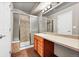 Bathroom featuring tiled shower and floors and a wood vanity at 17359 Waterhouse Cir # C, Parker, CO 80134
