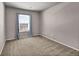Neutral bedroom featuring carpet flooring and natural light from the window at 17359 Waterhouse Cir # C, Parker, CO 80134
