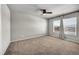 Spacious bedroom featuring carpeted floors, neutral walls, and two large windows at 17359 Waterhouse Cir # C, Parker, CO 80134