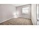 Neutral bedroom featuring carpet flooring and natural light from the window at 17359 Waterhouse Cir # C, Parker, CO 80134