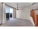 Dining area features sliding glass door, chandelier, and access to the patio at 17359 Waterhouse Cir # C, Parker, CO 80134
