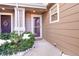 Townhome entrance with storm door and landscaping at 17359 Waterhouse Cir # C, Parker, CO 80134