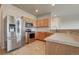 Bright kitchen features stainless steel appliances, ample cabinet space and a tile floor at 17359 Waterhouse Cir # C, Parker, CO 80134