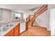 Open kitchen featuring a sink, dishwasher, and a staircase leading to the upper level at 17359 Waterhouse Cir # C, Parker, CO 80134