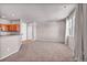 The open-concept living room has modern finishes, light gray walls, and natural light at 17359 Waterhouse Cir # C, Parker, CO 80134